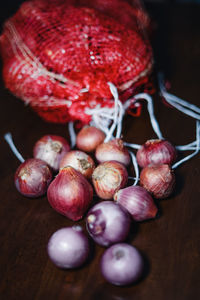 Fresh onion in malaysia during preparation of eid mubarak on a wooden textured background