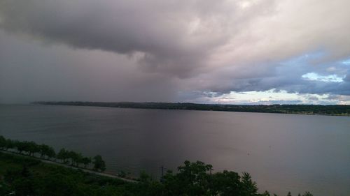 Scenic view of sea against cloudy sky