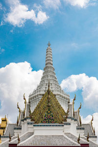 Low angle view of temple building against cloudy sky