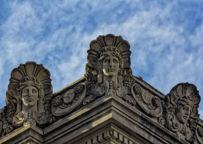 Low angle view of statue against sky