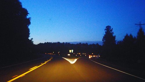 Illuminated road at night
