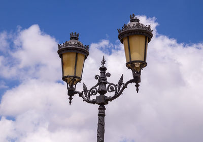 Low angle view of street light against sky