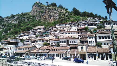 Buildings in town against clear sky