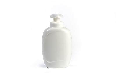 Close-up of bottle against white background