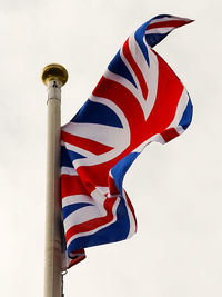 Low angle view of flag against sky