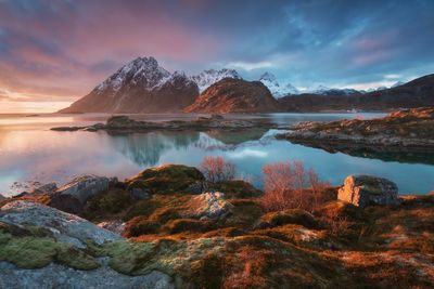 Scenic view of lake against sky during sunset