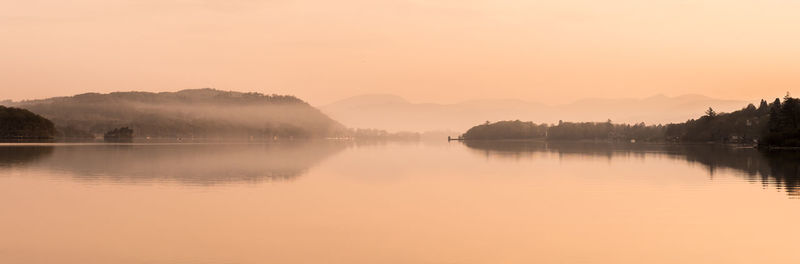 Scenic view of lake against sky during sunset