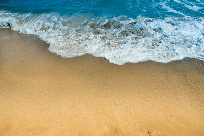 High angle view of surf on beach