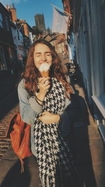 Young woman smiling on street in city