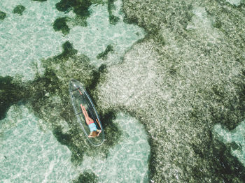 High angle view of man swimming in sea