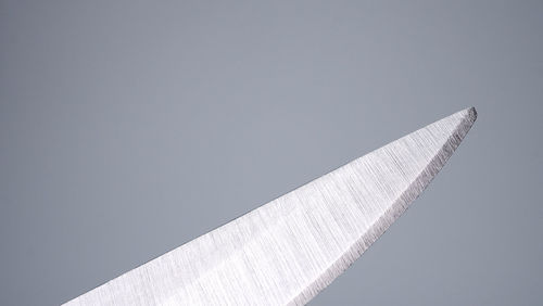 Low angle view of airplane flying against clear sky