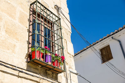 Low angle view of building against clear blue sky