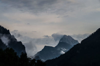 Scenic view of silhouette mountains against sky
