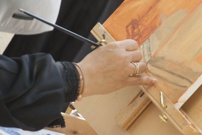Close-up of man working on wood