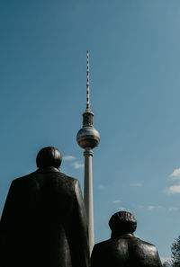 Low angle view of statue against clear blue sky