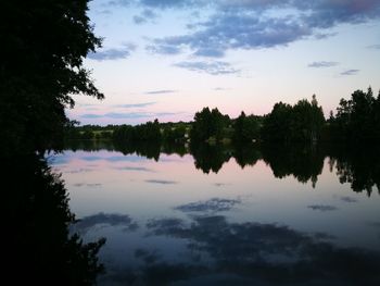 Scenic view of lake against sky during sunset