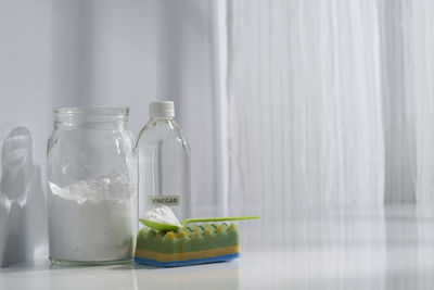 Close-up of glass jar on table