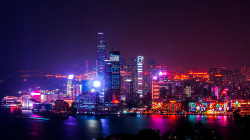 Illuminated buildings in city at night