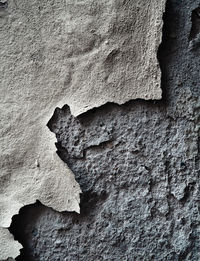 Full frame shot of peeling damaged wall