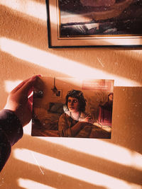 Portrait of woman photographing at home