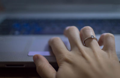 Close-up of hand using mobile phone