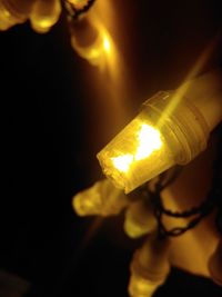 Close-up of illuminated light bulb