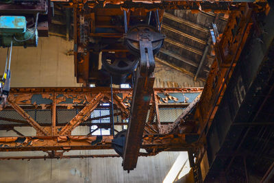 Low angle view of old machinery in industry
