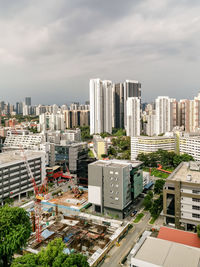 High angle view of modern buildings in city against sky redhilll, singapore - may 20 2020