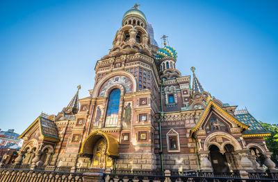 Low angle view of temple building against blue sky