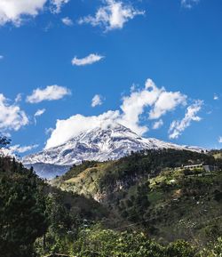 Scenic view of landscape against cloudy sky