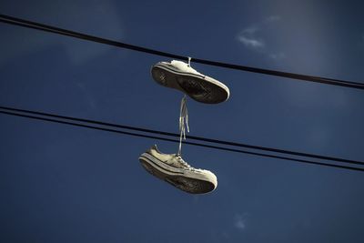 Converse shoes hanging from power lines