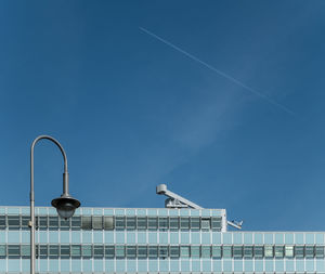 Low angle view of buildings against clear blue sky