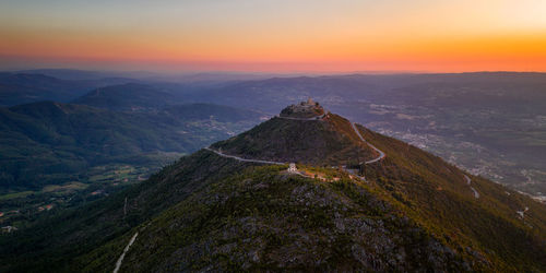 Scenic view of mountains against sky during sunset