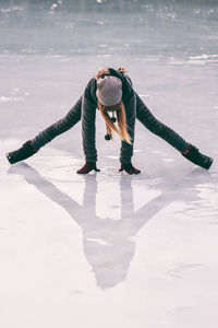 Young woman with arms on the ground