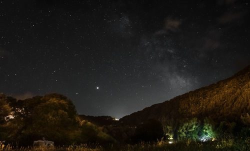 Scenic view of star field against sky at night