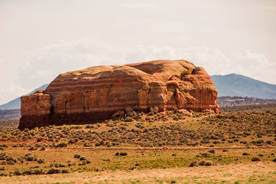 Rock formations in desert against sky