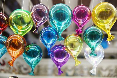 Close-up of multi colored balloons hanging at home