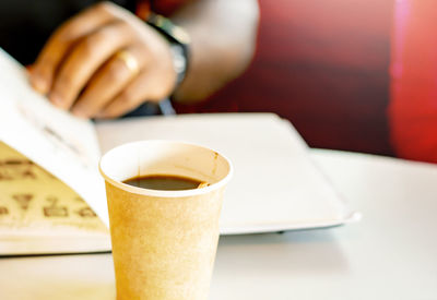 Close-up of coffee cup on table