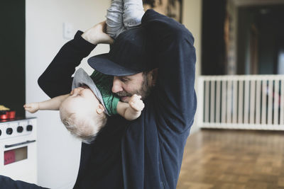 Father playing with baby boy