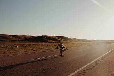 Man riding motorcycle on road