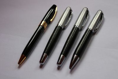 Close-up of pens on table