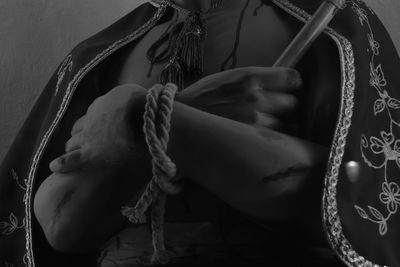 Close-up of rope tied up on metal