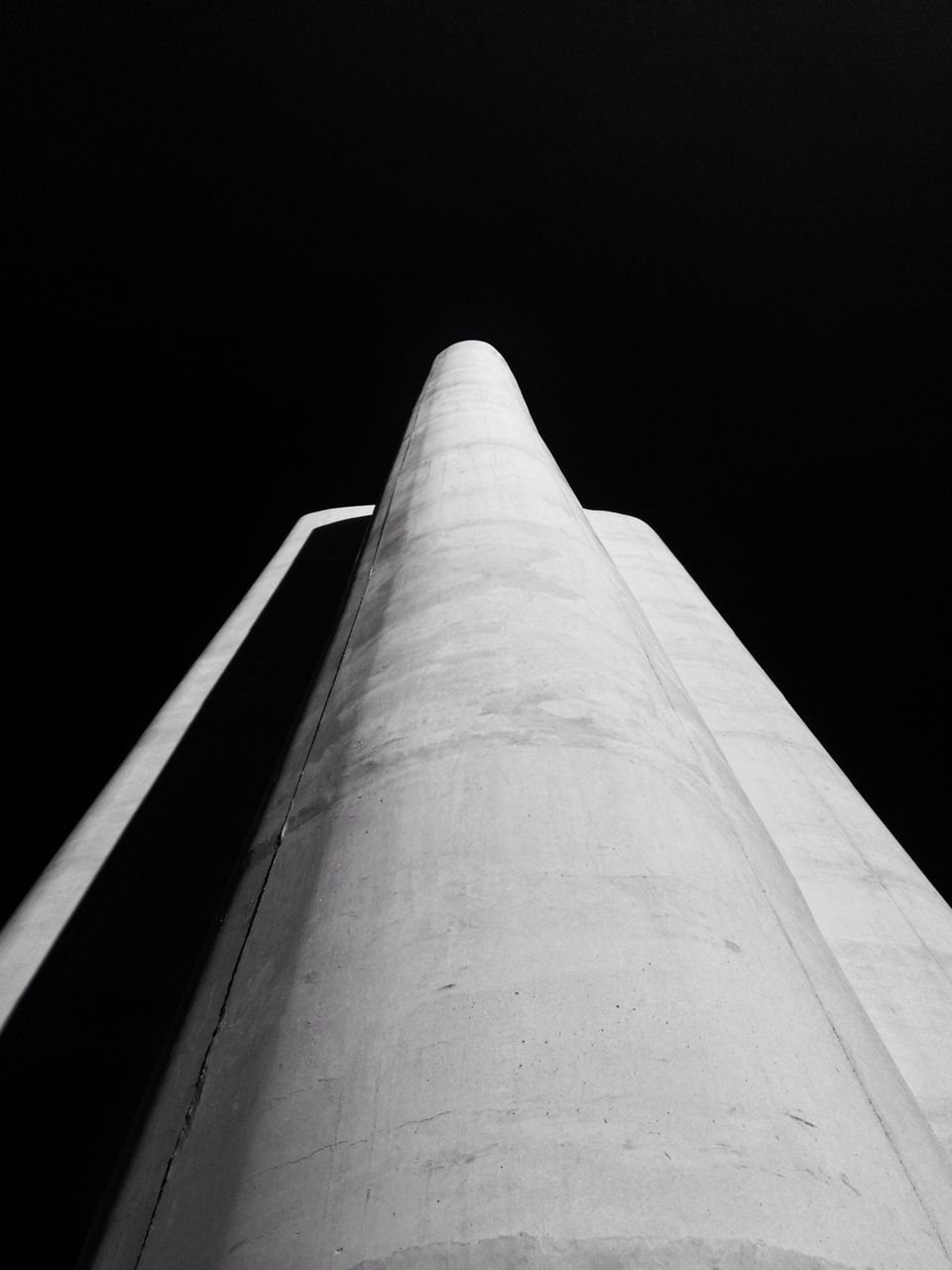 copy space, clear sky, night, the way forward, built structure, low angle view, railing, diminishing perspective, architecture, vanishing point, outdoors, connection, no people, long, transportation, sky, illuminated, dark, bridge - man made structure