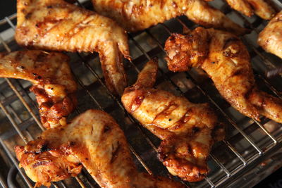 High angle view of meat on barbecue grill