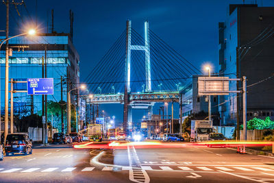 Illuminated city street at night