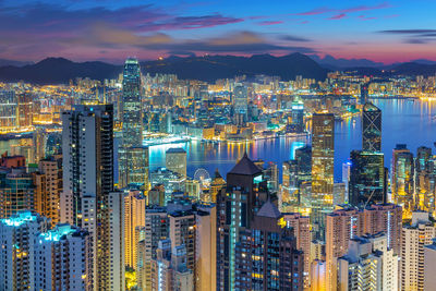 Aerial view of city lit up at night