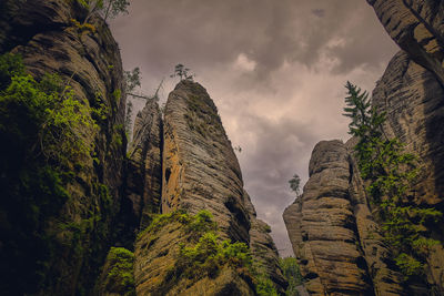 Low angle view of rocks against sky