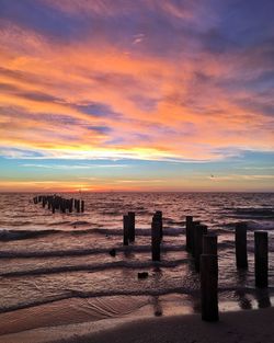 Scenic view of calm sea at sunset