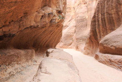 Walkway amidst rock formations at petra