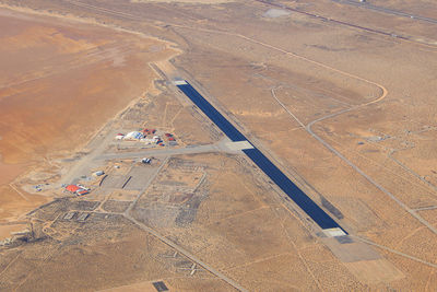 High angle view of airplane on airport runway